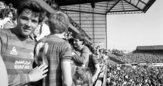 Joe McLaughlin and the Chelsea players celebrate winning promotion to the top division after beating Leeds United 5-0.  STAMFORD BRIDGE,  28th April 1984. 
