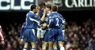 Tore Andre Flo is congratulated on scoring by Poyet, Zola and Petrescu