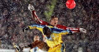 Tuesday Frank Sinclair heads the ball in the snow v Tromso