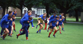The Chelsea squad doing some piggy-back training in the park, circa 1986