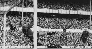 18 March, 1967. Goalkeeper Pat Jennings of Spurs dives in vain to save the goal from 16 year old Chelsea midfielder Chico Hamilton as Tommy Baldwin number 8 looks on during their English League Division One match on 18 March 1967 at the White Hart Lane stadium, London