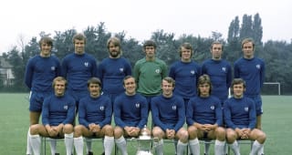 The Chelsea FA Cup Final squad with the trophy, circa August 1970. Back row (left-right): Ian Hutchinson, Peter Osgood, David Webb, Peter Bonetti, Eddie McCreadie, Marvin Hinton, John Dempsey. Front row: Tommy Baldwin, Charlie Cooke, Ron Harris, Peter Houseman, Alan Hudson, John Hollins.