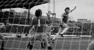 LONDON, UNITED KINGDOM - FEBRUARY 7  : Chelsea's Micky Droy scores with a flying header during the Football League Division Two match between Chelsea and Cambridge United at Stamford Bridge, on 7th February 1981. Chelsea won the match 3-0.  