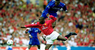 13 Aug 2000:  Marcel Desailly outjumps Andy Cole of Manchester United during the Charity Shield at Wembley Stadium in London.  Chelsea won the match 2-0. \ 