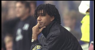 12 Oct 1996:  Ruud Gullit the Chelsea manager studies his team's play during the FA Carling Premier League match between Leicester City and Chelsea at Filbert Street in Leicester. Chelsea went onto win the match by 1-3. 
