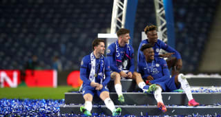 PORTO, PORTUGAL - MAY 29: Ben Chilwell, Mason Mount, Tammy Abraham and Callum Hudson-Odoi of Chelsea sit of the winners podium as they celebrate their victory during the UEFA Champions League Final between Manchester City and Chelsea FC at Estadio do Dragao on May 29, 2021 in Porto, Portugal. 