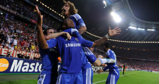 Ivorian forward Didier Drogba celebrate with team mates after scoring a goal during the UEFA Champions League final football match between FC Bayern Munich and Chelsea FC on May 19, 2012 at the Fussball Arena stadium in Munich.   