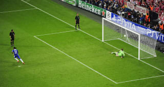Didier Drogba sends Bayern Munich's  goalkeeper Manuel Neuer the wrong way to score the winning goal during the penalty shootout of the UEFA Champions League final football match between FC Bayern Munich and Chelsea FC on May 19, 2012 at the Fussball Arena stadium in Munich.  Chelsea beat Bayern Munich 4-3 on penalties to win the Champions League.    