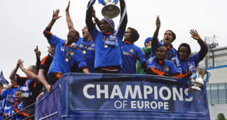 (L-R) Members of the Chelsea squad,  Ashley Cole, captain John Terry, Didier Drogba, Jose Bosingwa, Salomon Kalou, and Raul Meireles, celebrate with their trophy as they leave Stamford Bridge, stadium, for their victory parade on the streets in west London on May 20, 2012.  