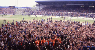 Thursday UK - MAY 3: Chelsea fans celebrate beneath the East Stand Directors Box after the Football League Division 2 match between Chelsea and Oldham Athletic held on May 3, 1980 at Stamford Bridge. Chelsea won the match 3-0 but Chelsea missed out on promotion to Division One on goal difference.