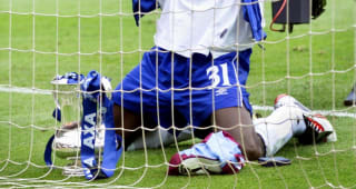 Liberian Geoge Weah celebrates with the FA Cup in the goalmouth at Wembley Saturday 20 May 2000. Roberto Di Matteo scored the only goal defeating Aston Villa 1-0 