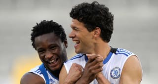 Wednesday MACAU, CHINA - JULY 25: Michael Ballack returns to training and shares a joke with John Obi Mikel During Chelsea FC training in The Macau International Stadium on July 25, 2008 in Macau.