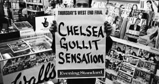 The newsagent opposite Stamford Bridge prepares to post the day's headline about Chelsea manager Ruud Gullit parting company with the club in February 1998 during the 1997/98 season on the Fulham Road. 