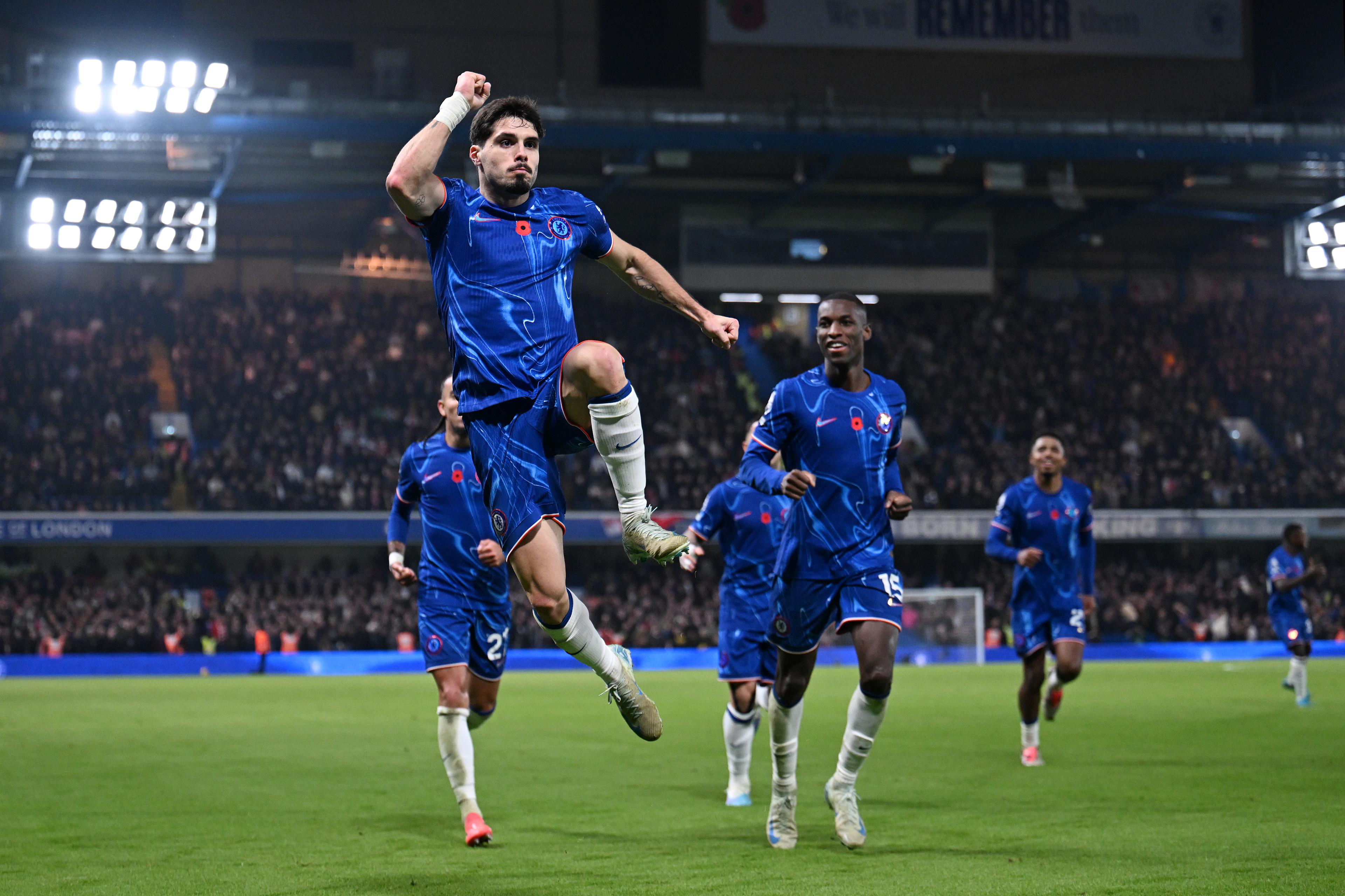 Pedro Neto celebrates scoring for Chelsea against Arsenal in November 2024