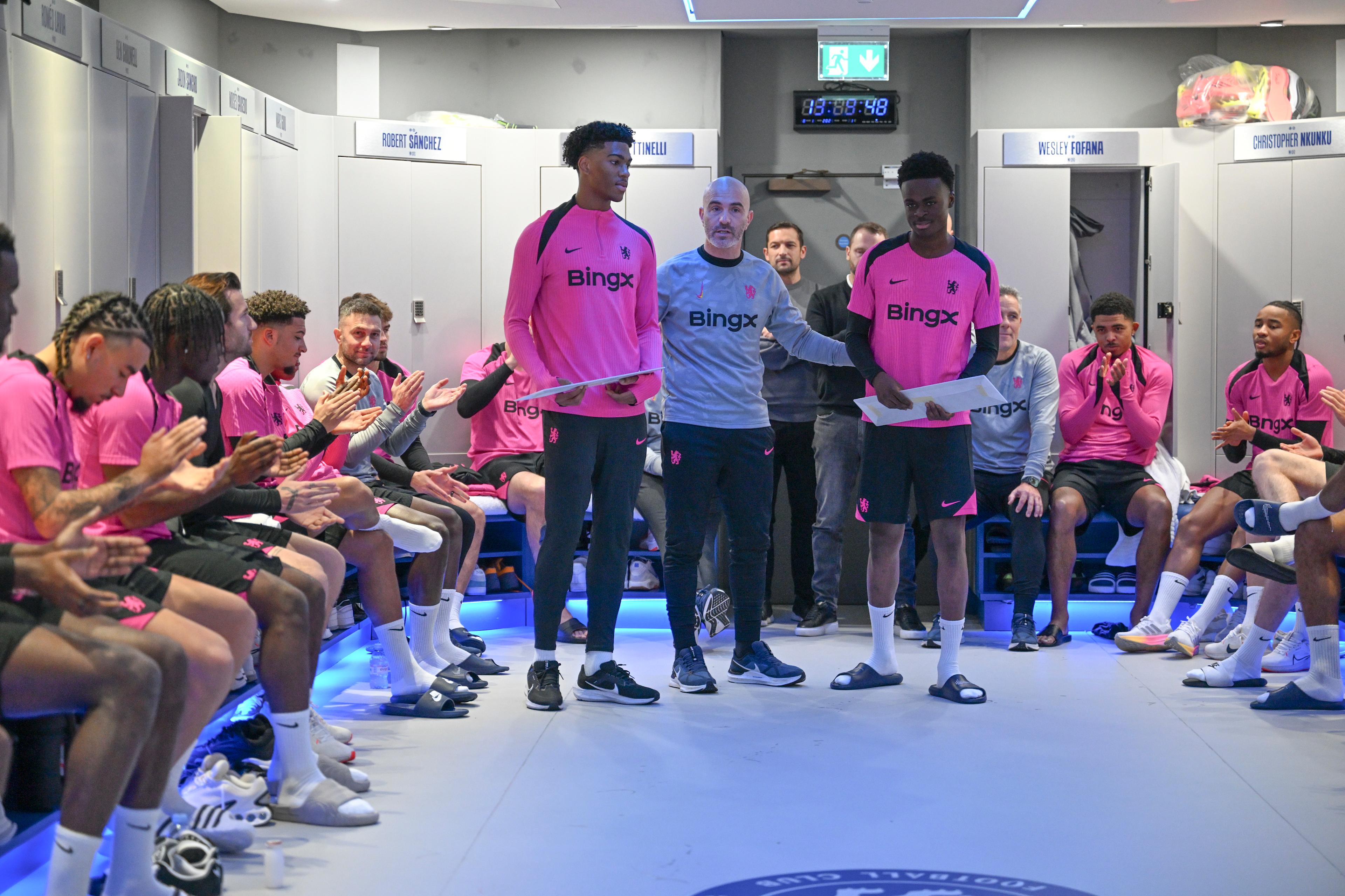 Josh Acheampong and Tyrique George smile together in the Chelsea dressing room