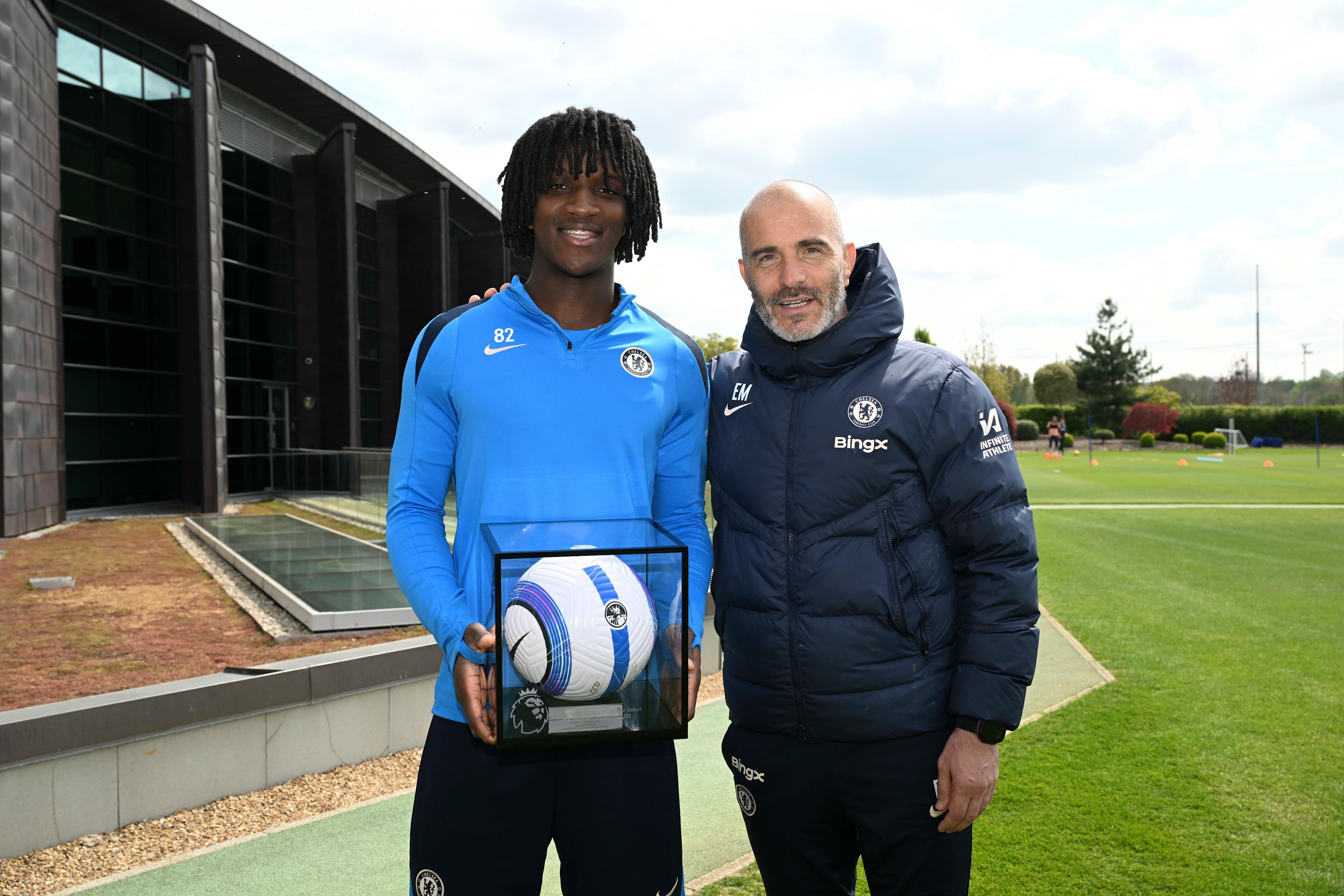 Enzo Maresca presents Shim Mheuka with a commemorative Premier League debut ball at Cobham