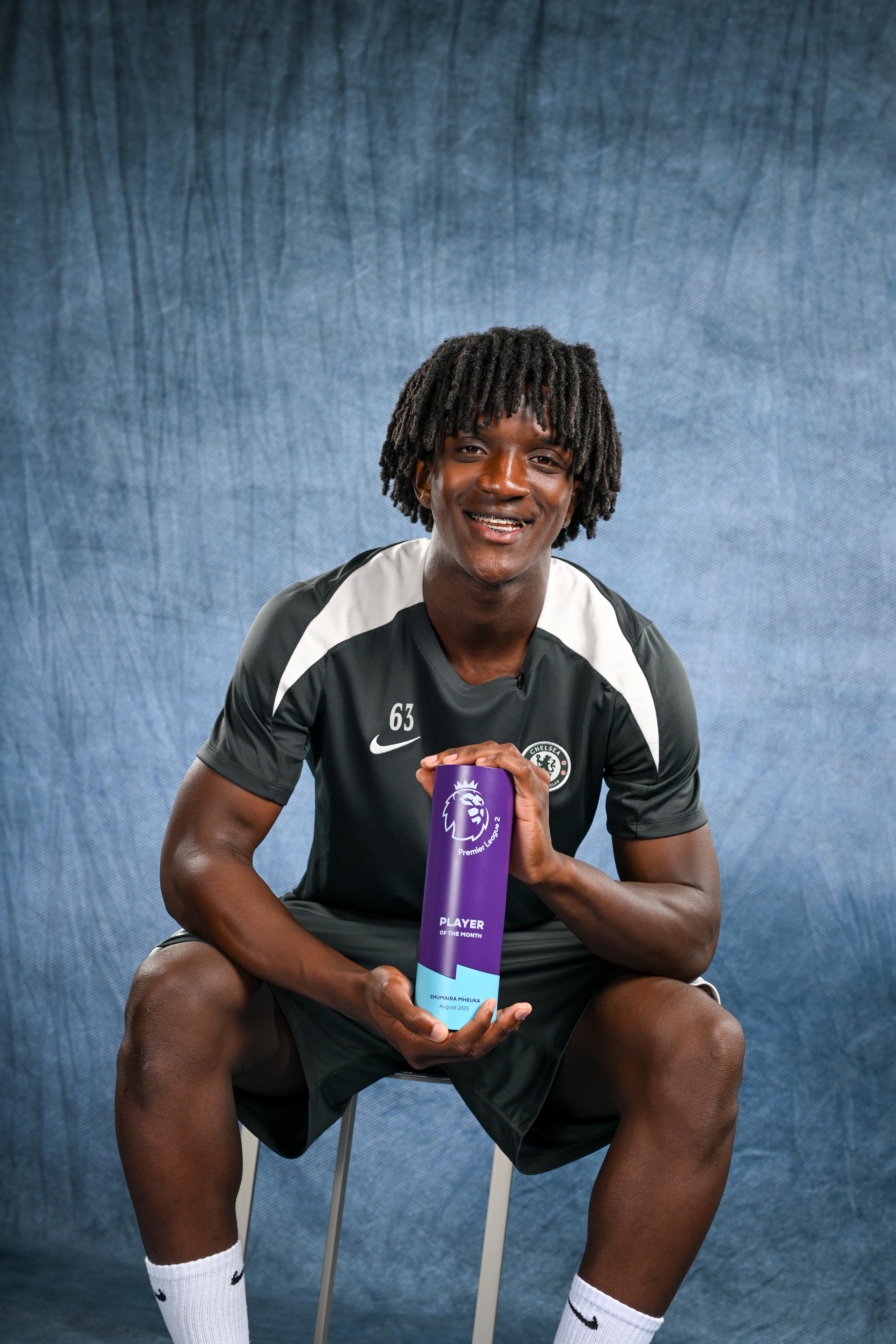 Shim Mheuka holds the Premier League 2 Player of the Month award at Cobham