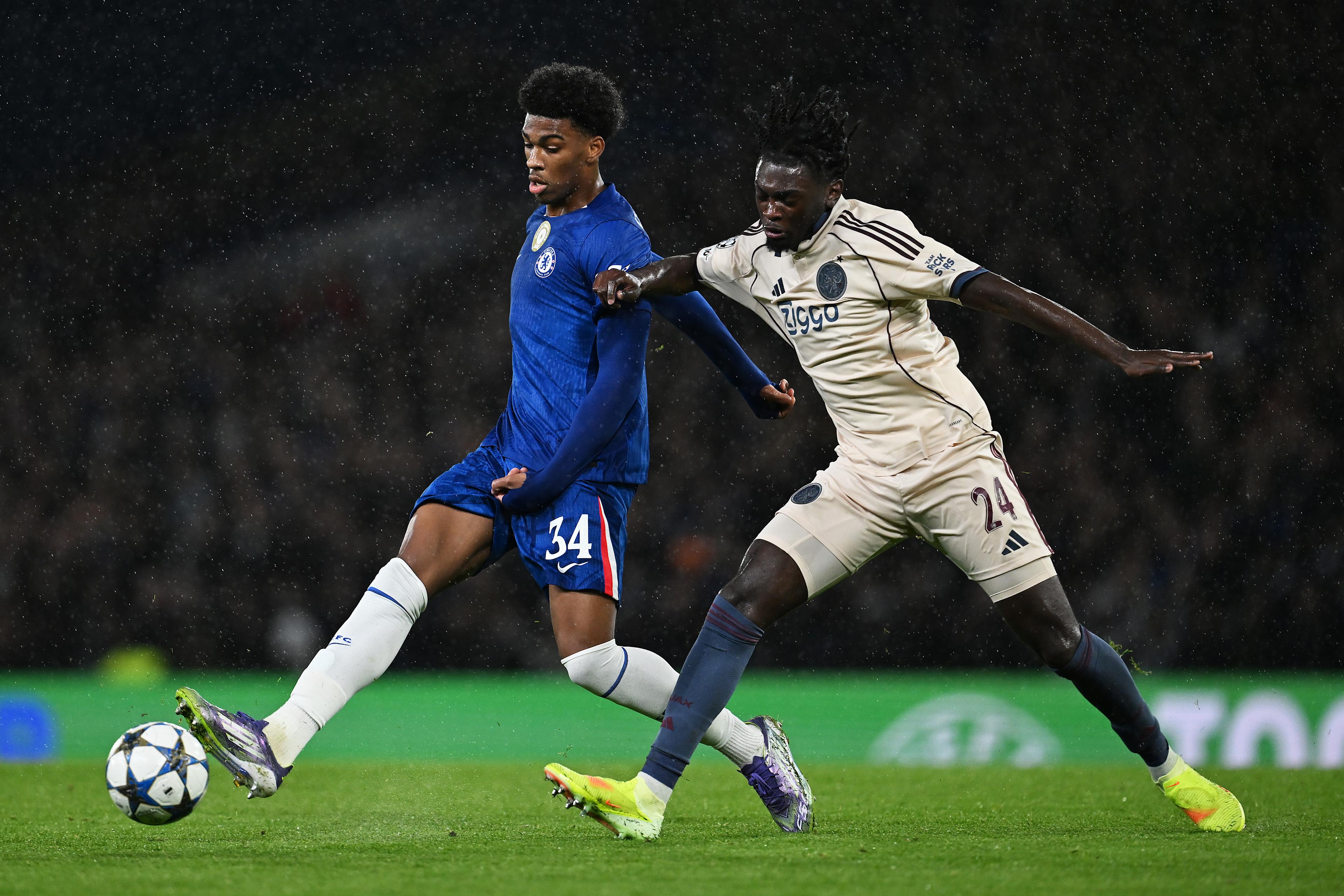 Josh Acheampong carries the ball for Chelsea against Ajax in the Champions League