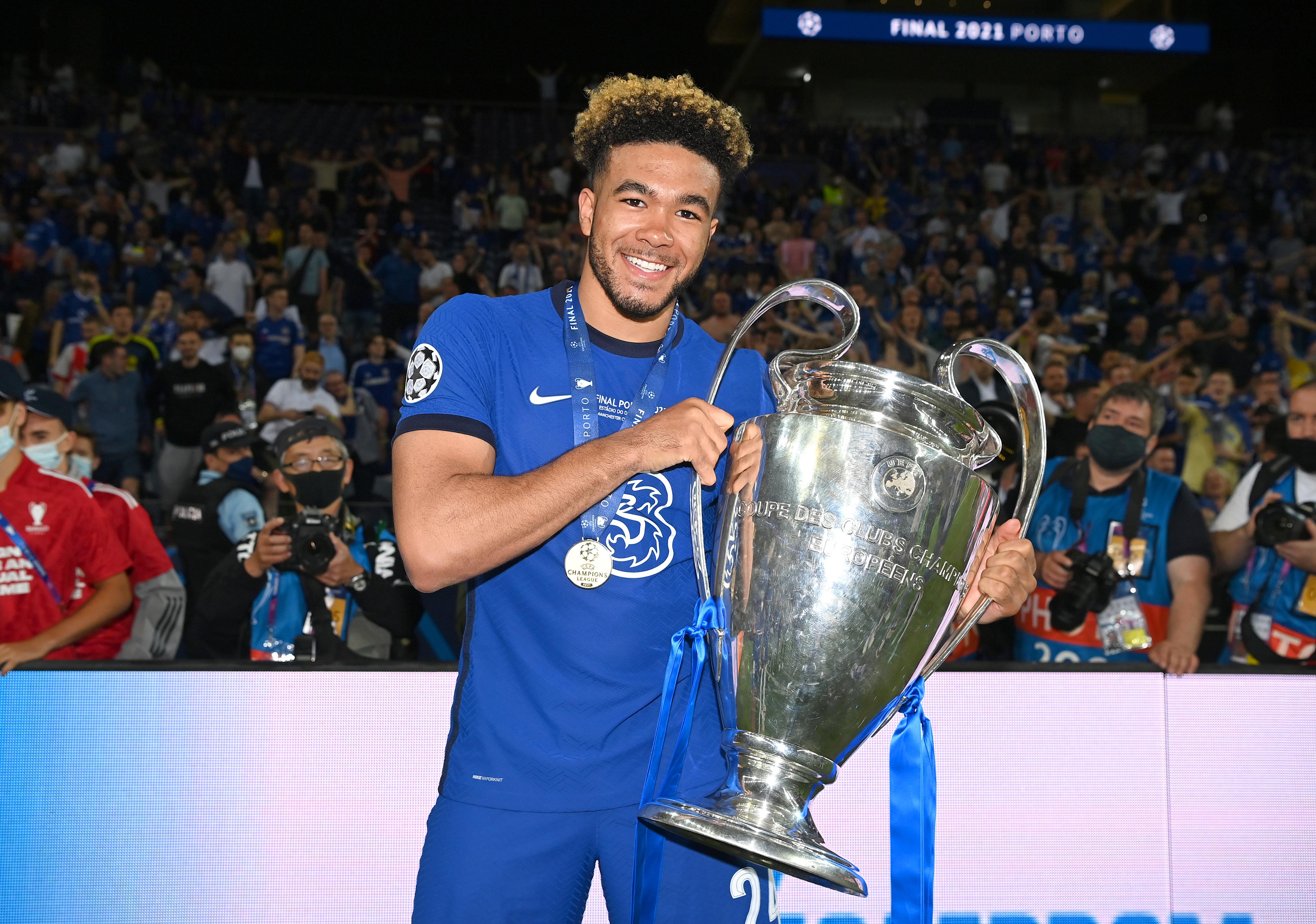 Reece James celebrates with the Champions League trophy in Porto