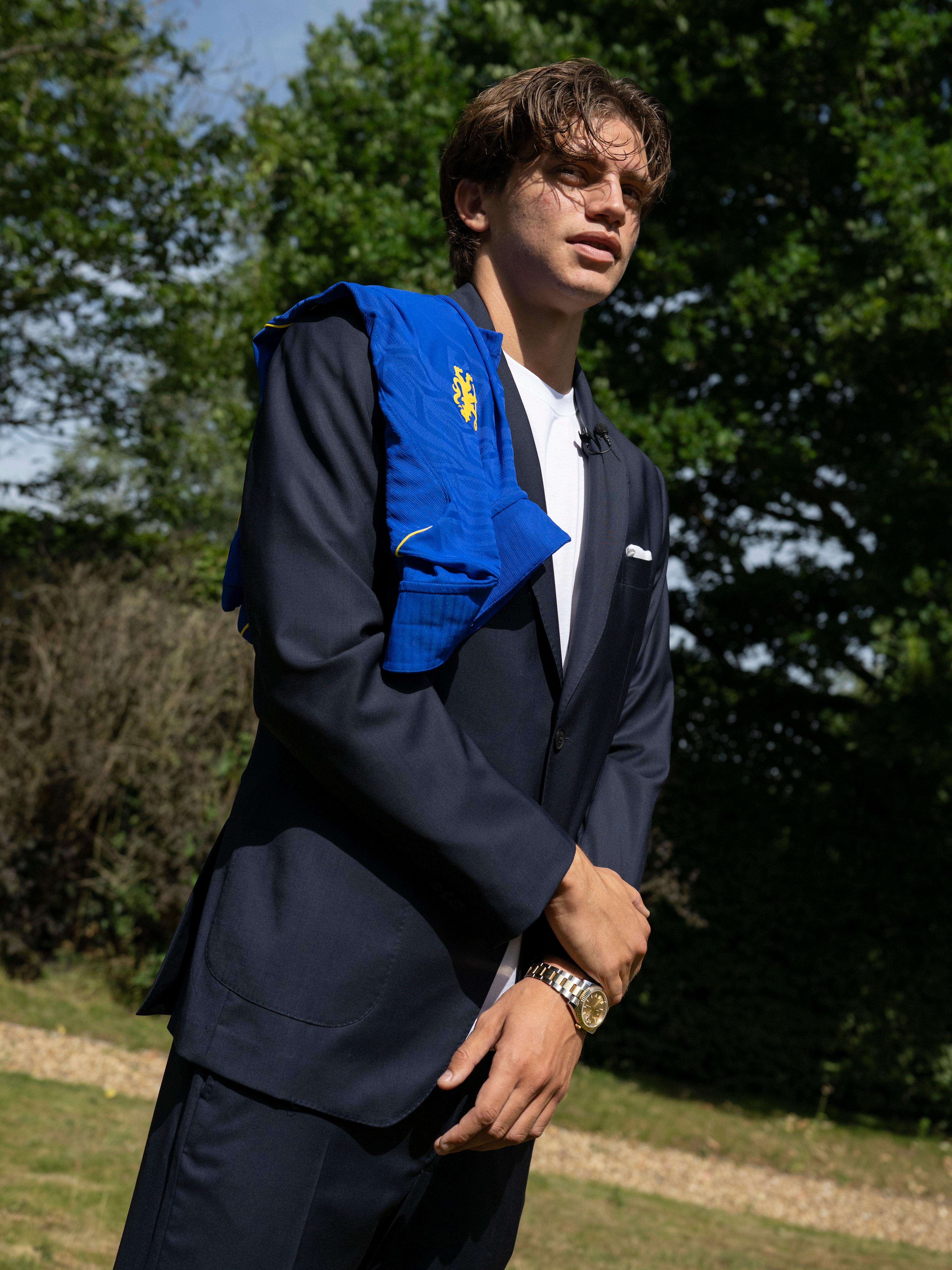 Marco Palestra poses in a Chelsea shirt after joining the club in July 2026