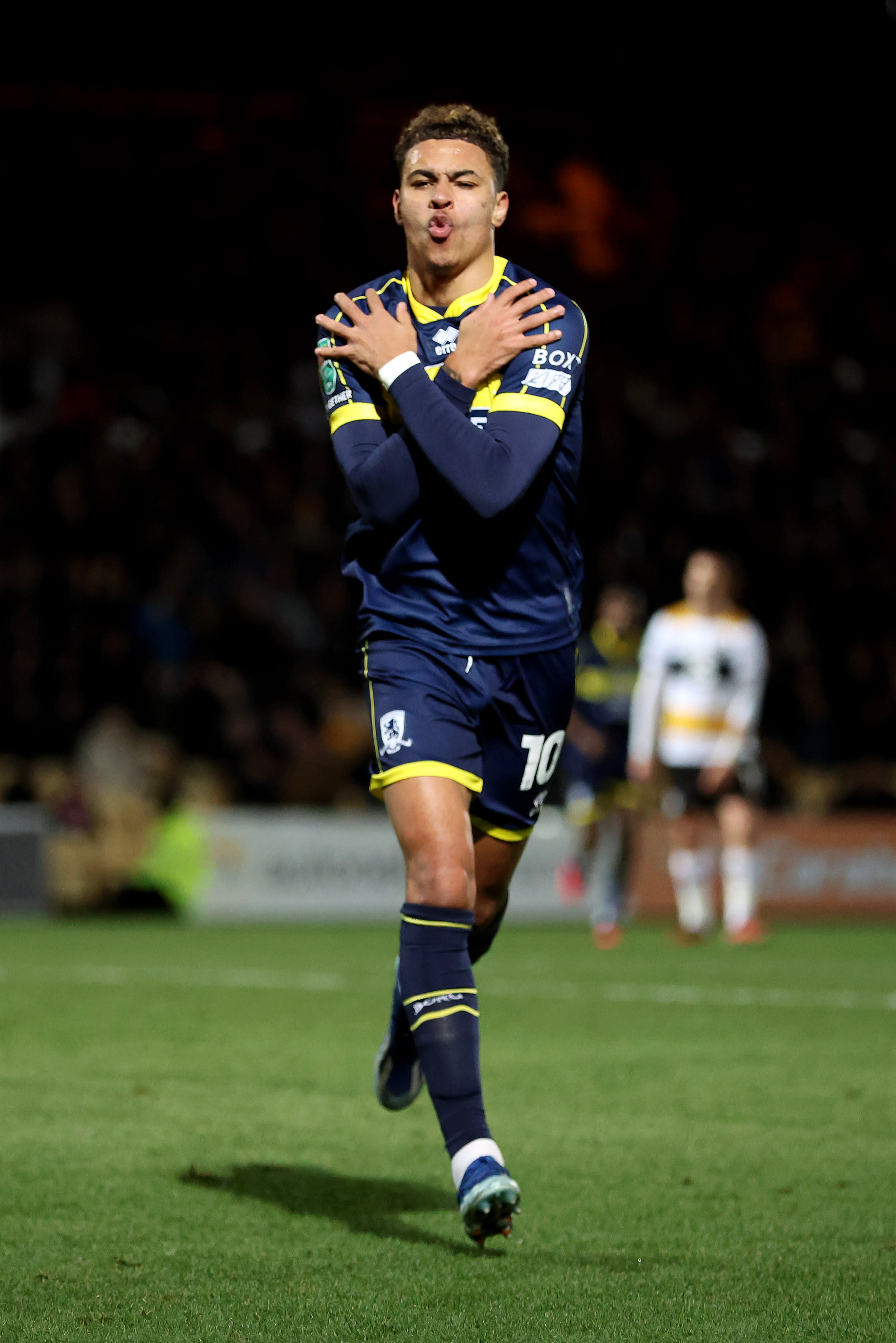 Morgan Rogers crosses his arms to celebrate a Middlesbrough goal