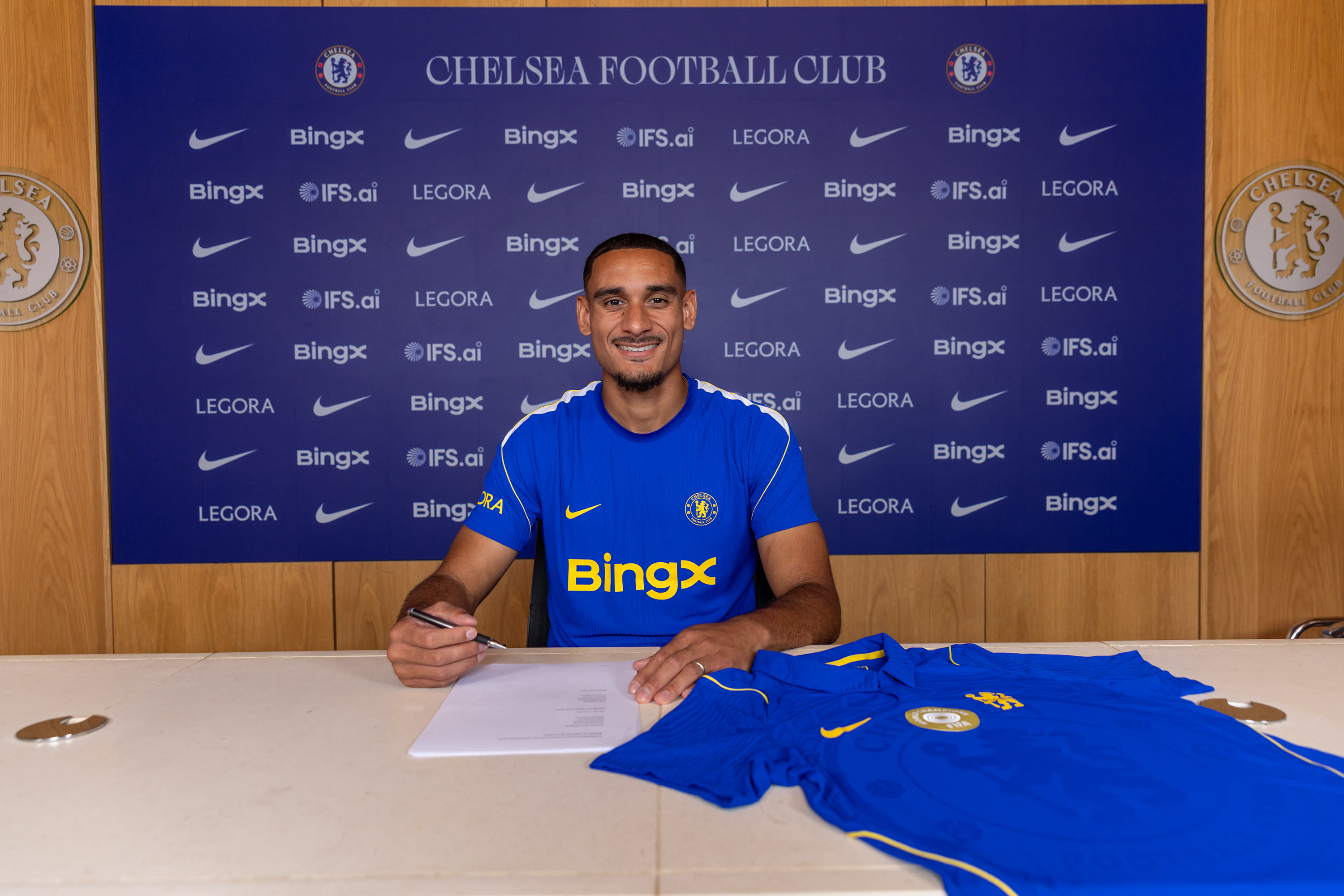 Maxence Lacroix signs his Chelsea contract at Cobham