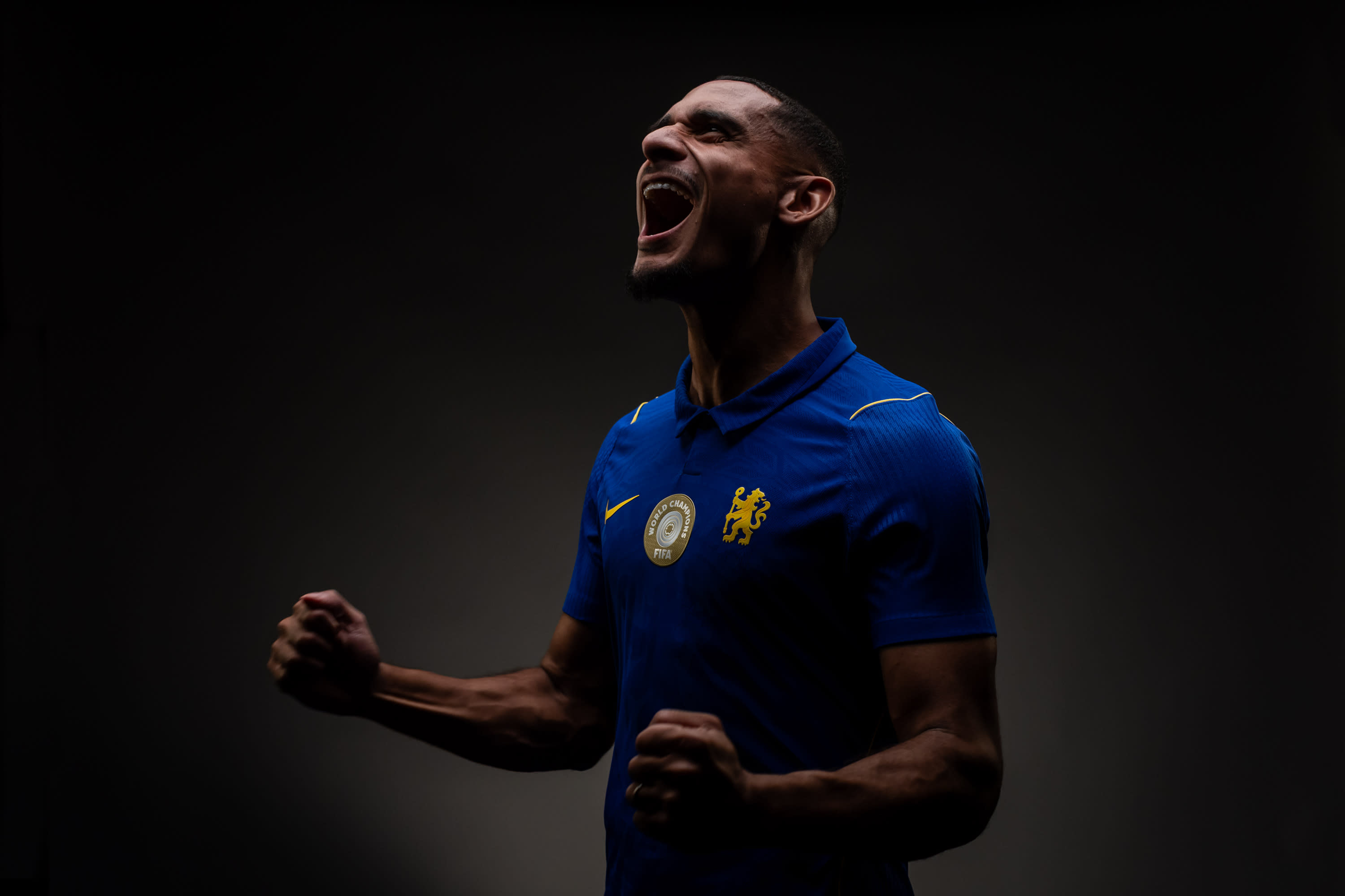 Maxence Lacroix poses in Chelsea's home kit during his signing-day shoot