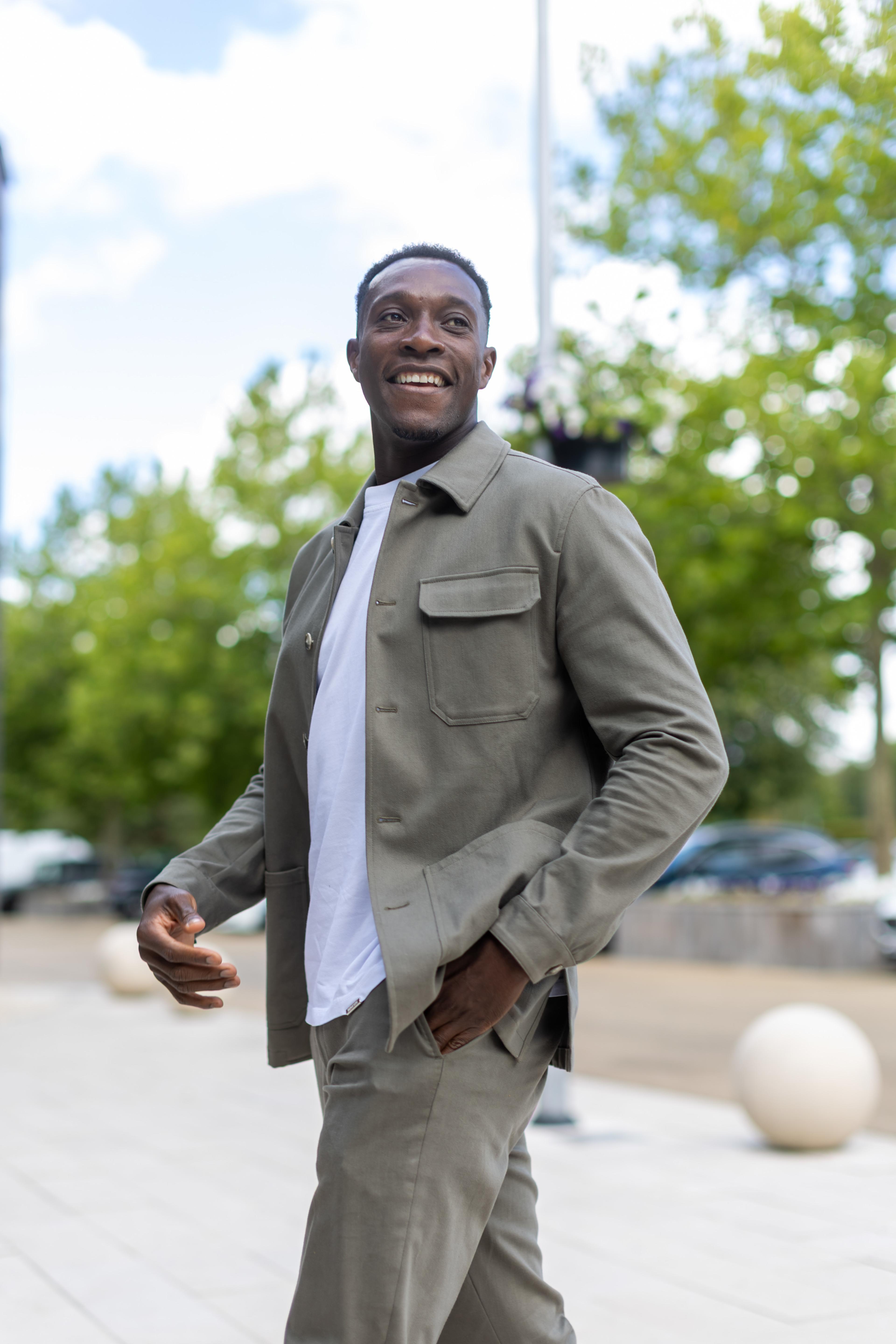 Danny Welbeck smiles as he arrives at Chelsea's Cobham training ground in July 2026