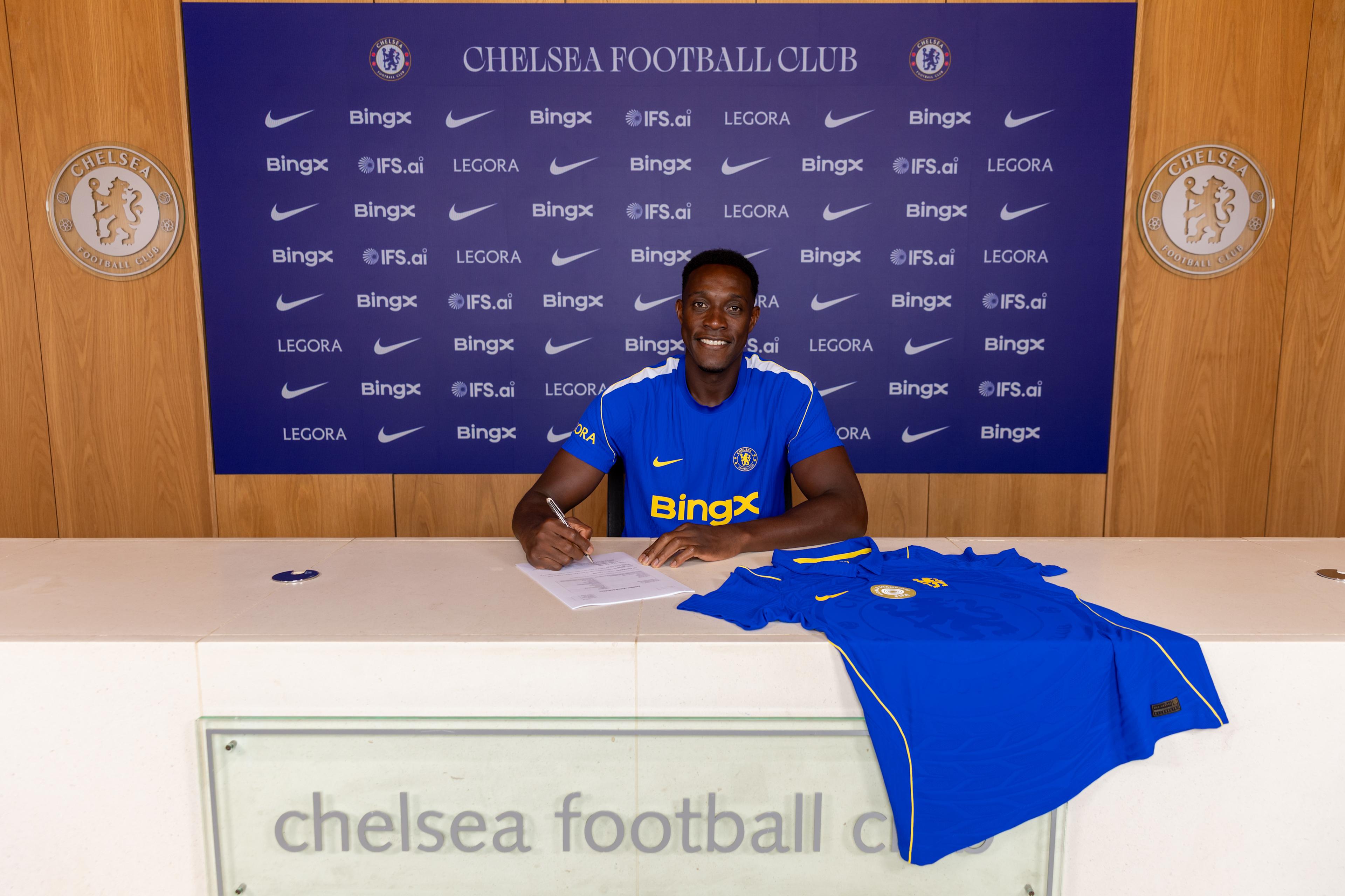 Danny Welbeck signs his Chelsea contract at Cobham in July 2026