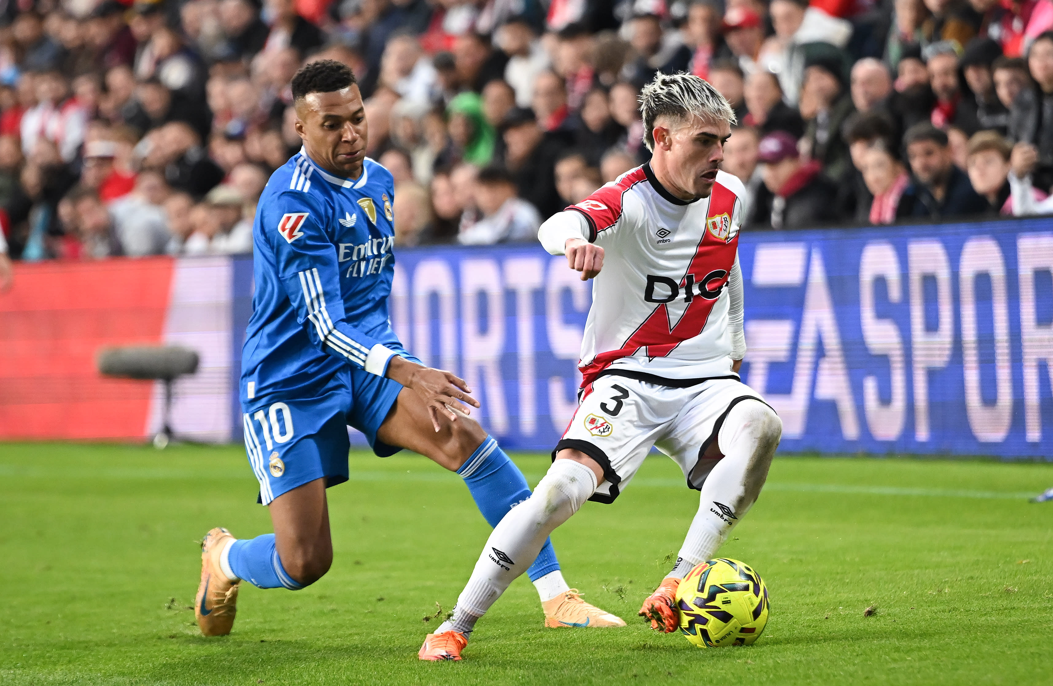 Pep Chavarría challenges Kylian Mbappé during Rayo Vallecano's match against Real Madrid