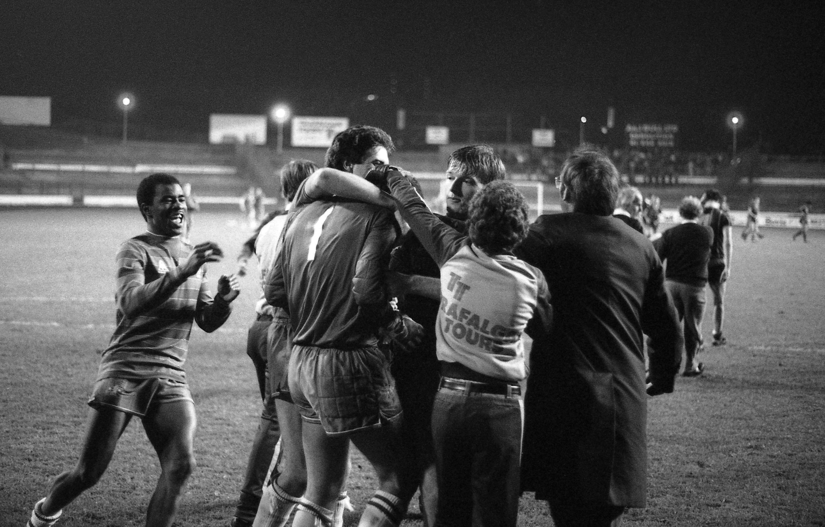Niedzwiecki is mobbed by fans and team-mates after saving twice in our first shoot-out against Leicester