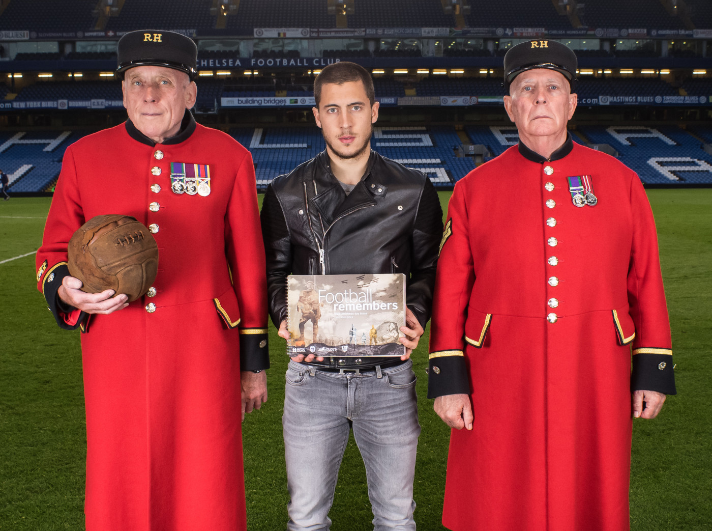 A football (held by the Chelsea Pensioner on the left), which was kicked across the battlefield at the Battle of Loos in 1915, featured in Remembrance in 2014