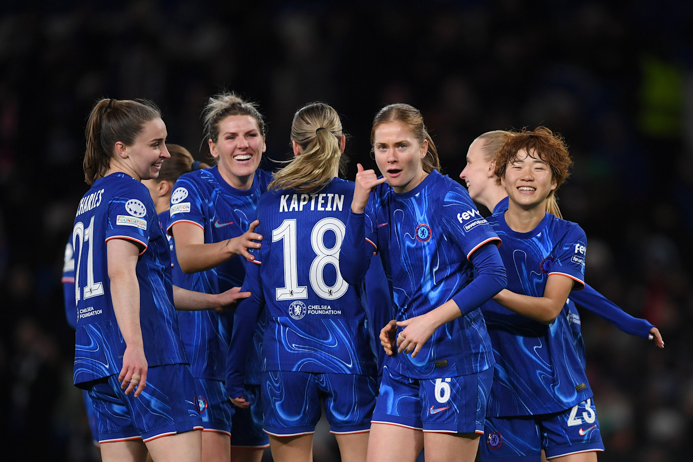 Nusken celebrates scoring on her 50th appearance