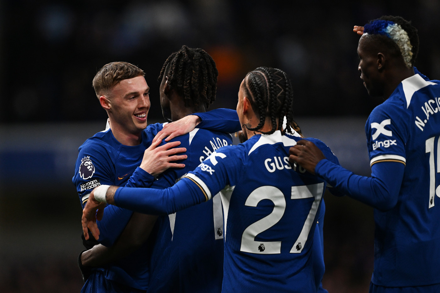 Cole celebrates during his four-goal haul against Everton