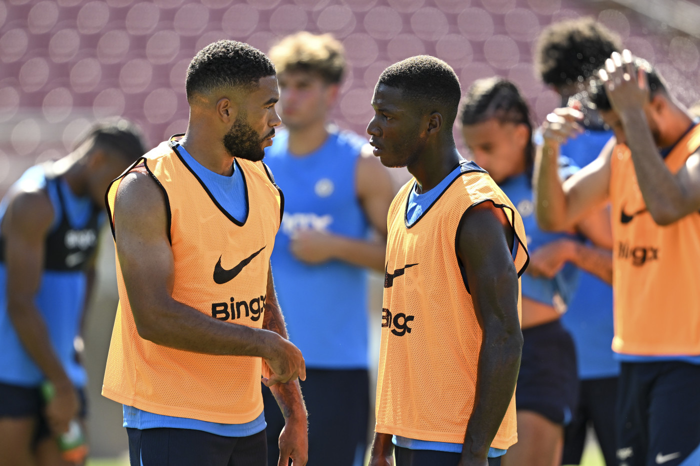 Reece James and Moises Caicedo talking during a training session 