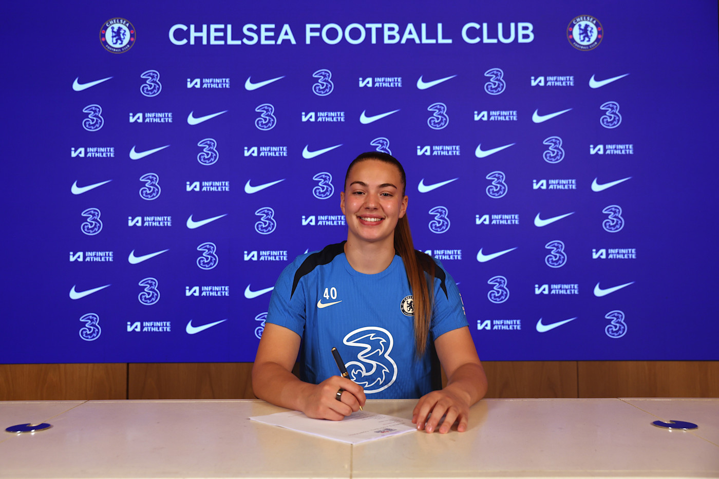 A first professional contract for Katie Cox