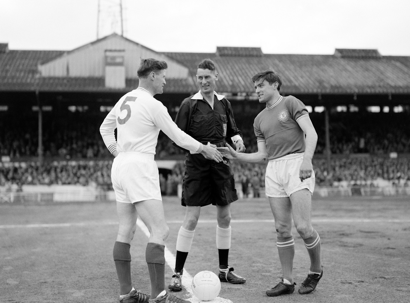 Shaking hands with his Portsmouth counterpart in the final game of the promotion-winning season