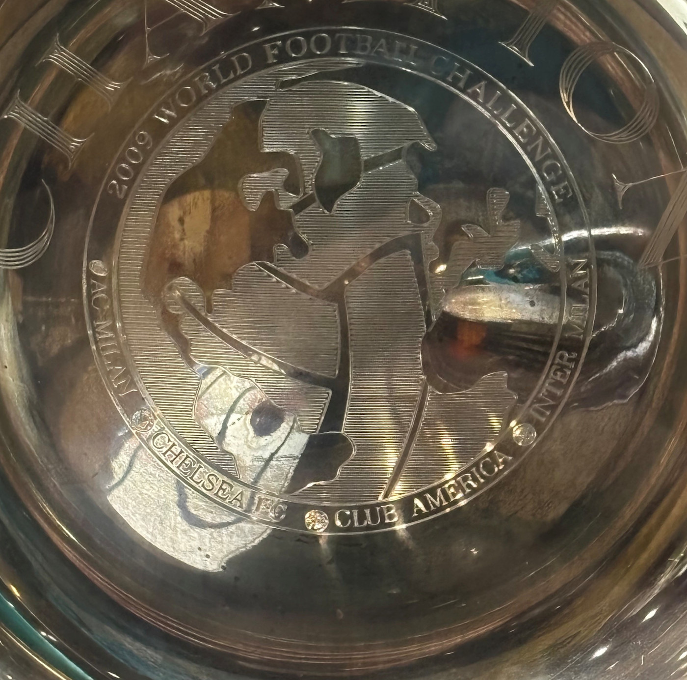 The detail on the trophy includes the names of the teams involved
