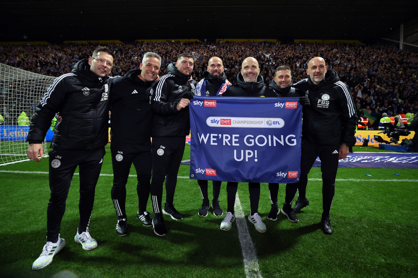 The Italian celebrates promotion with his staff