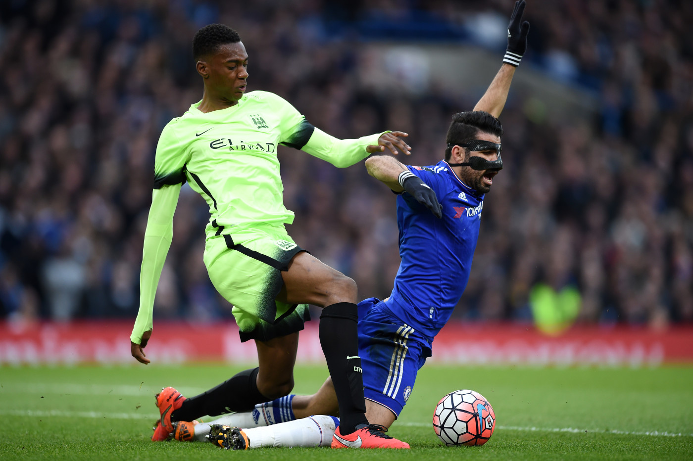 Tosin and Diego Costa battle for the ball back in 2016